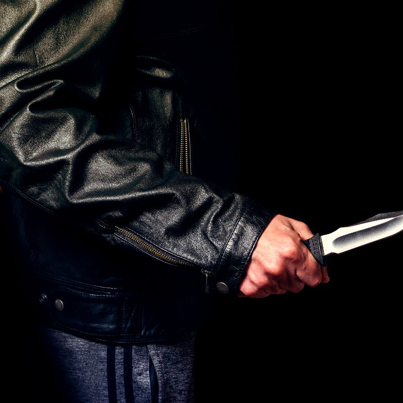 close-up of a man holding a knife