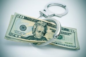 Money and handcuffs, bail bonds