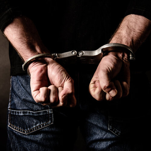 Man in handcuffs.