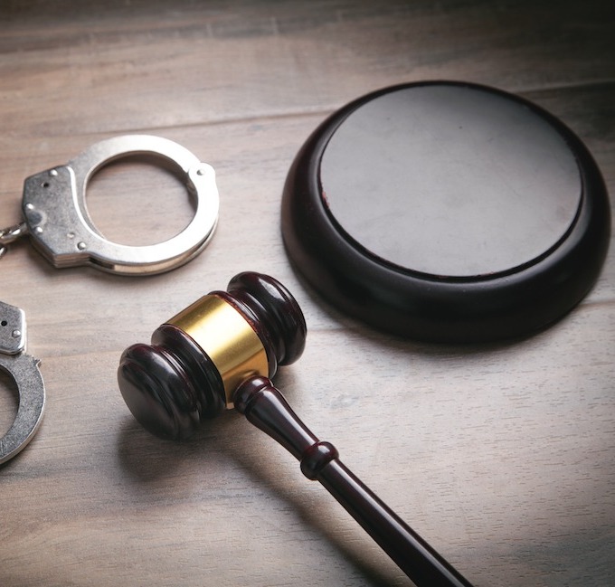 A gavel, podium and handcuffs